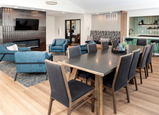 a living room filled with furniture and a flat screen tv