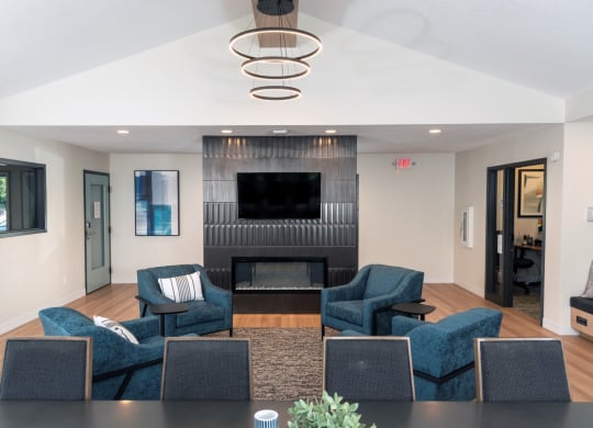 a living room filled with furniture and a fire place