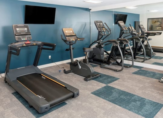 a room filled with lots of exercise equipment