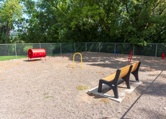 a park bench in front of a playground