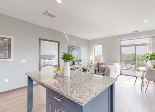 A kitchen with a large island and a dining table with chairs. at Lake Jonathan Flats, Minnesota
