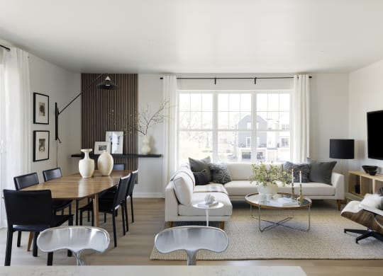 a living room with a couch and a table and a television