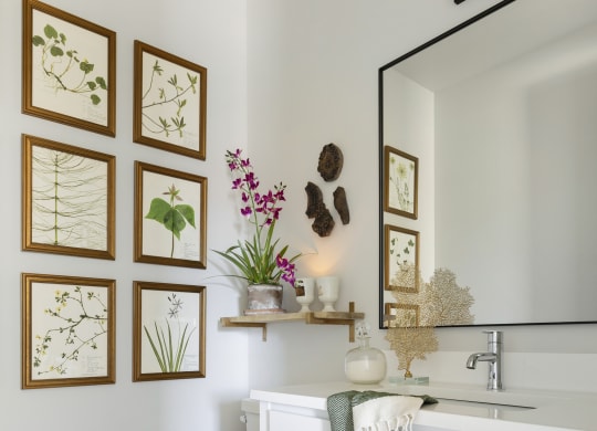 a bathroom with a toilet and a sink and a mirror