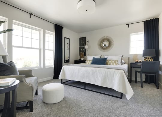 a bedroom with a bed and a living room