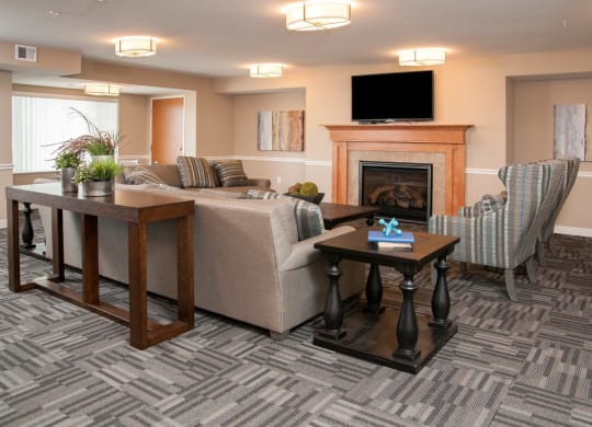 Community Room with Flat screen Television, Comfortable seeing area and Fireplace at Carver Crossing