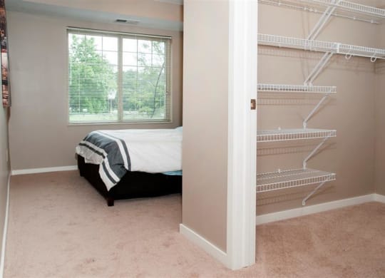 Walk-in Closet Connected to Master Bedroom with Built in Storage Racks at Carver Crossing