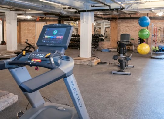 Fitness Center with Multiple Fitness Machines and Materials at 700 Central Apartments, 700 Central Avenue, Minneapolis