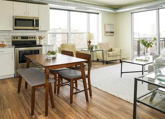 Kitchen with Dinning area at The Bessemer at Seward Commons Apartments, Minnesota, 55404