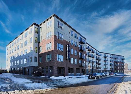A large apartment building with the name at The Bessemer at Seward Commons Apartments, Minneapolis, MN,  55404