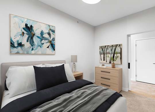 A bedroom with a bed, nightstand, and a painting on the wall.