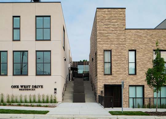 A building with the words "One West Drive Residences" on it.