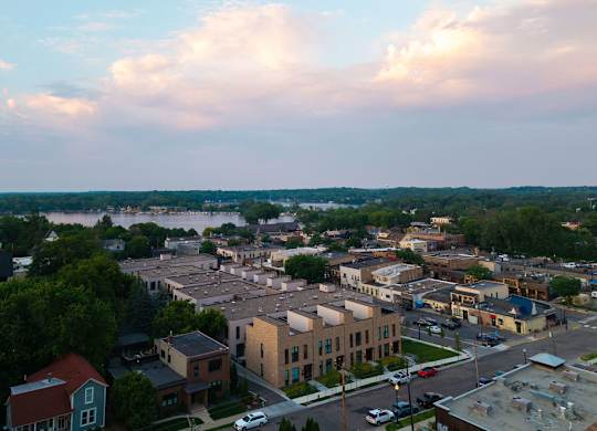 A small town with a lake in the background.