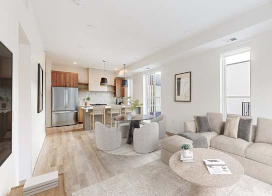 A modern living room with a grey sofa and a coffee table.