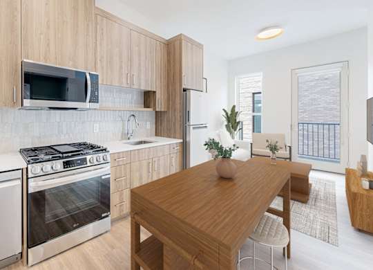 A modern kitchen with wooden cabinets and stainless steel appliances.