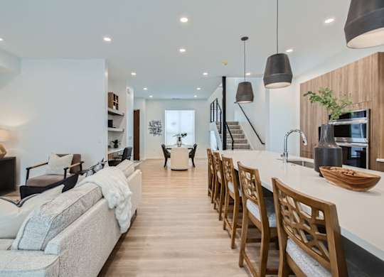 a living room with a kitchen and a dining room at One West Drive Apartments, Excelsior, 55331