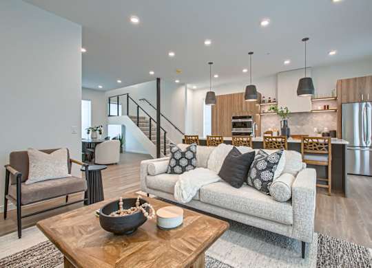 a living room with a couch and a table at One West Drive Apartments, Minnesota, 55331