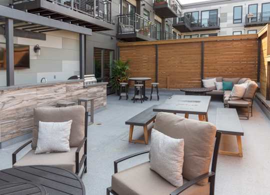 A patio with a table and chairs.
