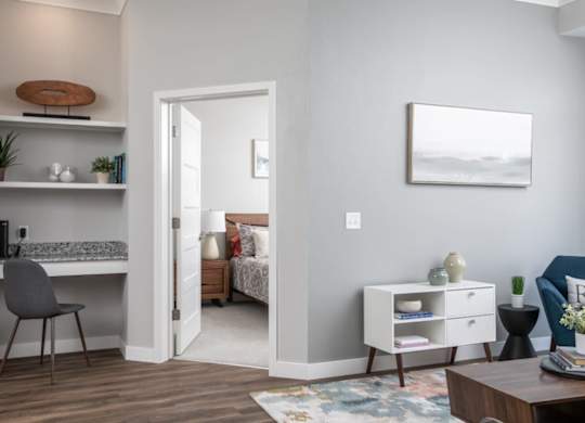 A room with a bed, a desk, and a chair.at The Edison at Maple Grove, Maple Grove, 55311