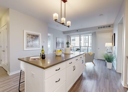 a kitchen with white cabinets and a counter top