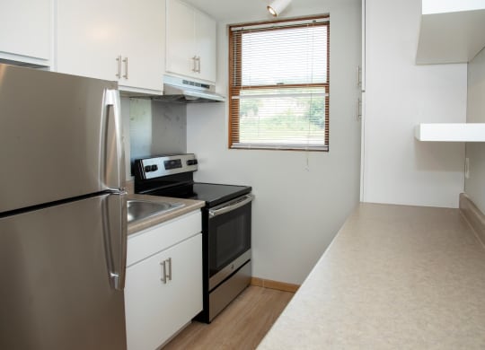 studio kitchen with floating shelves