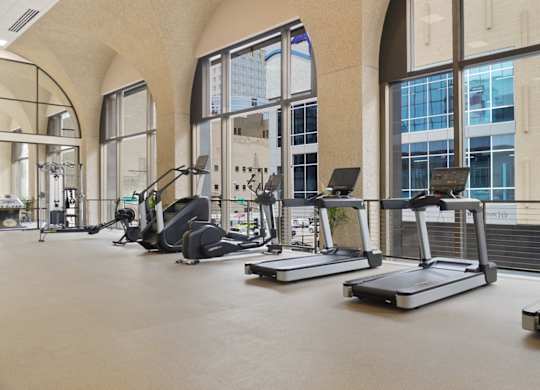 A gym with treadmills and exercise equipment.