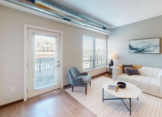 a living room with a white couch and a table