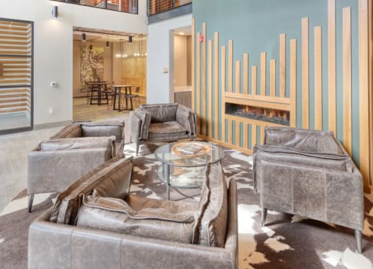 a large living room with couches and a fireplace