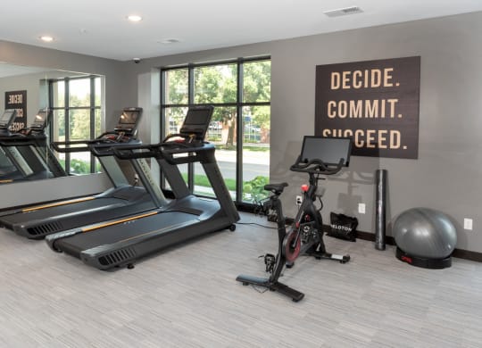 a gym with treadmills and other exercise equipment at The Exchange Apartments, Minnesota, 55112