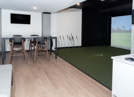 Golf Simulator With Table at The Exchange Apartments, New Brighton, MN