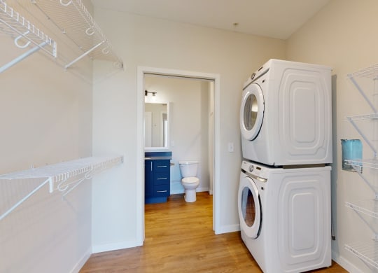 a washer and dryer in a laundry room at The Exchange Apartments, New Brighton, MN