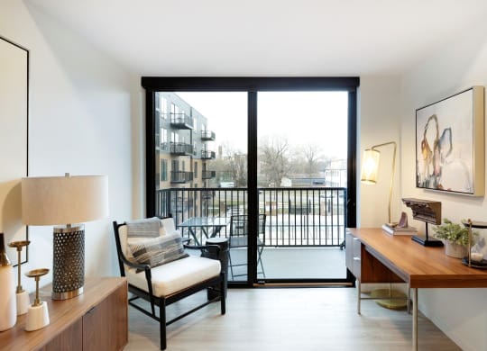 View of Balcony with glass door leading to a cityscape at The Hill Apartments, Saint Paul