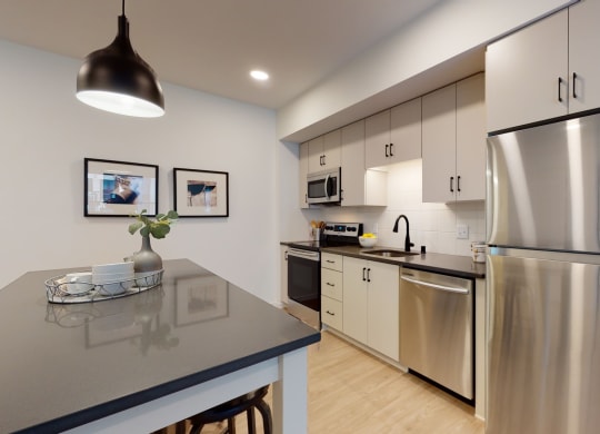 Kitchen With Dining at The Hill Apartments, Saint Paul, Minnesota
