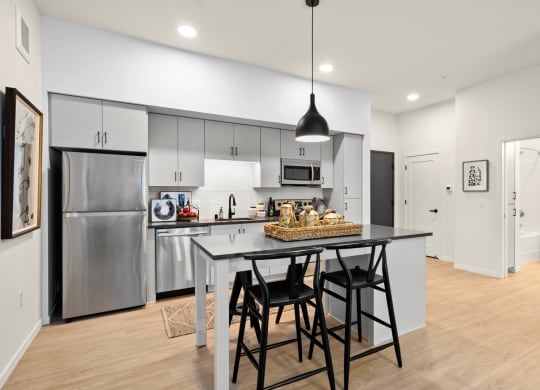 Fitted Kitchen With Island Dining at The Hill Apartments, Saint Paul, MN, 55103