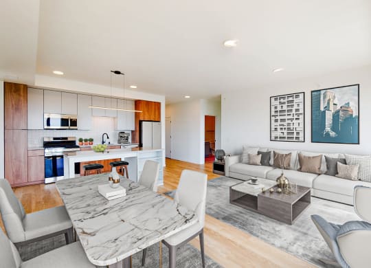 a living room and dining room with a table and chairs at The Mason, St. Paul, MN, 55114