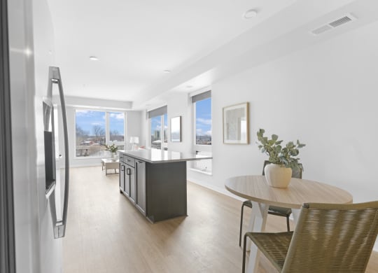 a kitchen and dining area in a 555 waverly unit