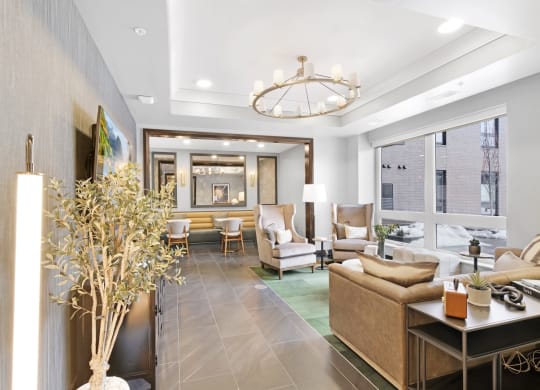 a living room filled with furniture and a large window