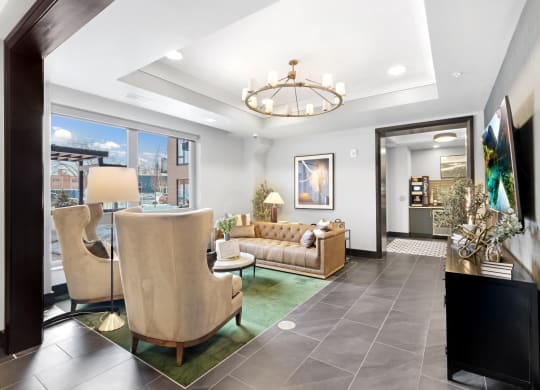 a living room with gray tile flooring and a chandelier hanging from the ceiling