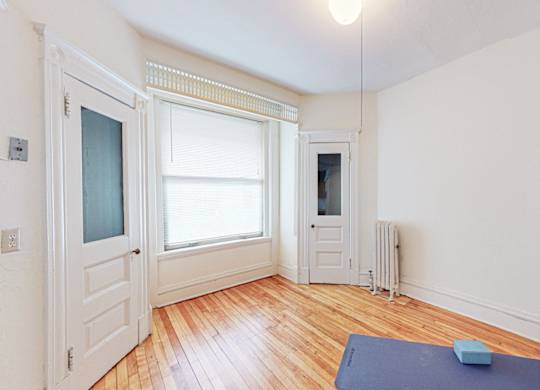 A room with a blue mat on the floor.