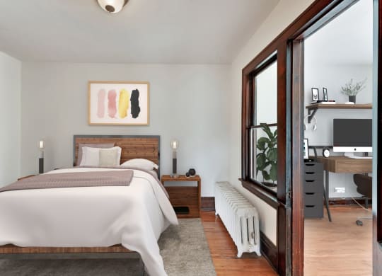 a bedroom with a bed and a window