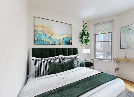 a bedroom with a bed and two windows