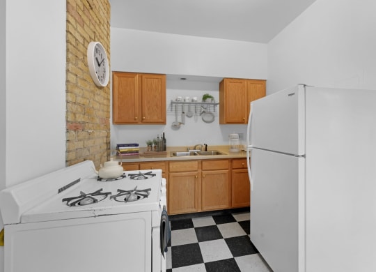 a kitchen with a white stove and a refrigerator