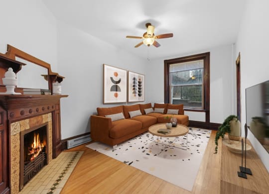a living room with a couch and a fireplace