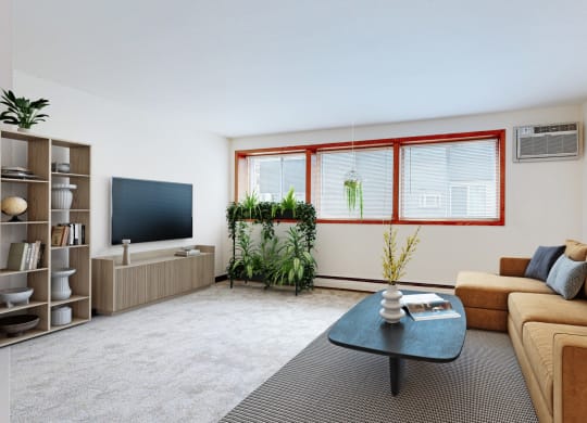 a living room with a brown couch and a coffee table