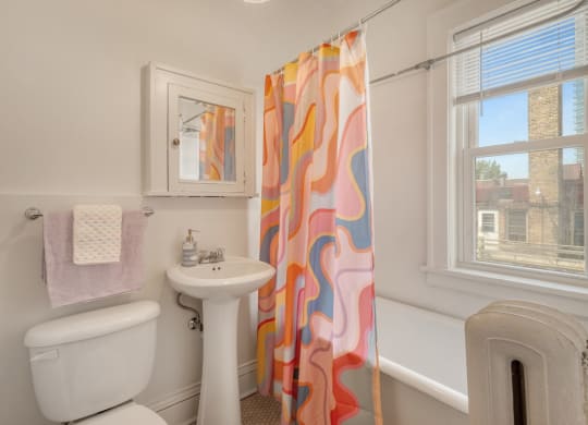a bathroom with a toilet sink and bathtub