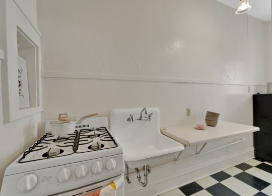 a kitchen with a stove and a sink