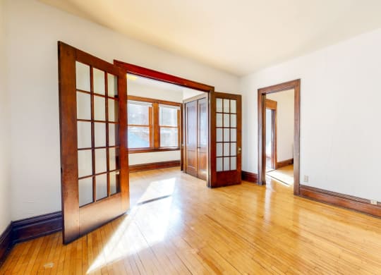 Double French Doors with Grid Pattern in Glass leading to Sitting Room at The Park Apartments in Minneapolis, MN