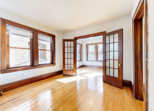 Gorgeous Apartment with French Double Doors with Grid Glass Pattern and Dark Contrasting Wood Trim at The Park Apartments in Minneapolis