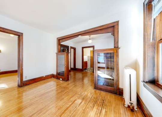 Stunning Apartment with Light Colored REsotred Hardwood Flooring and Contrasting Dark Wood Trim at The Park Apartments in MN 55403