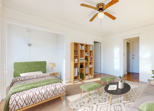 Spacious Bedroom with Intricate Bookshelves and Restored Hardwood Flooring at The Park Apartments in Minneapolis, 55403