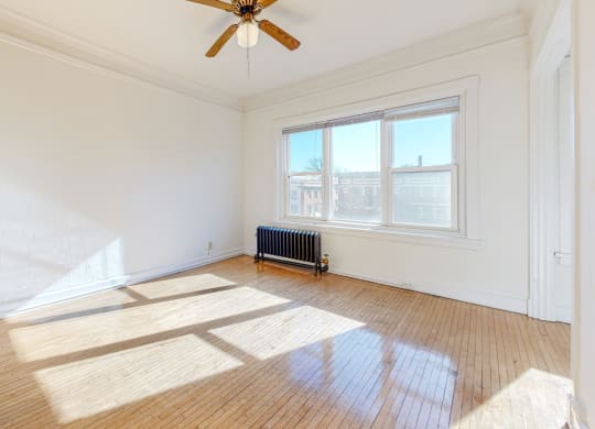 Apartment Layout with Restored Hardwood Floors, a Ceiling Fan, and Views Overlooking the City at The Park Apartments in Minneapolis, MN